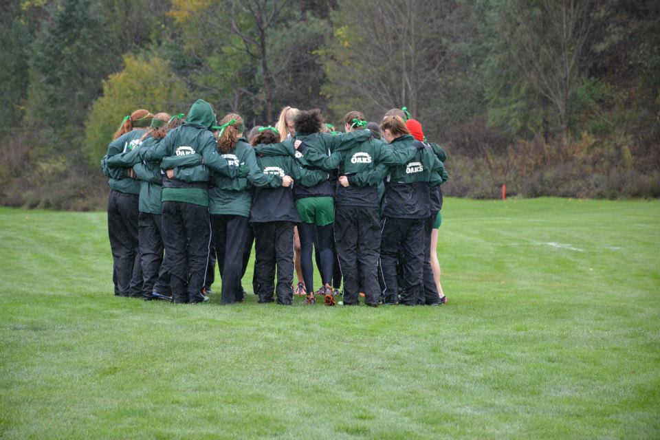 The women's cross country huddles up before the start of the 2014 USCAA Cross Country National Championships (Photo courtesy of Bob Beary)