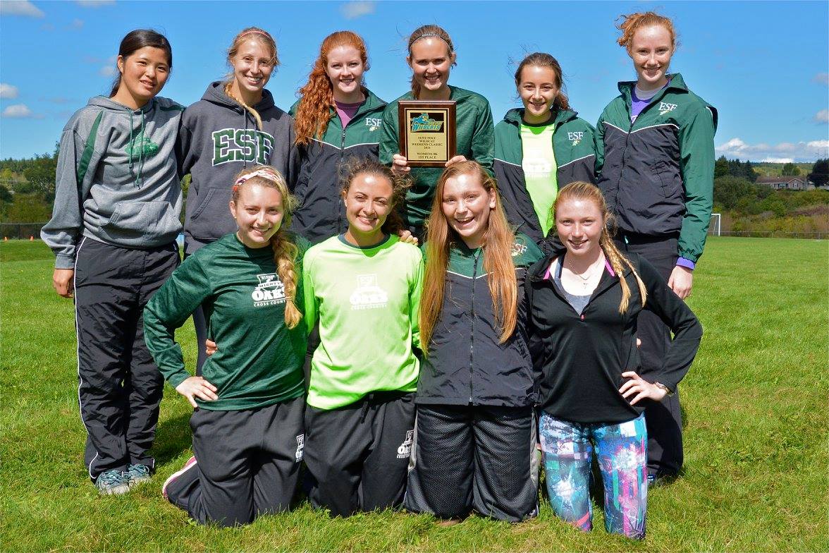 The women's cross country celebrate their first place finish at the SUNY Poly Wildcat Classic